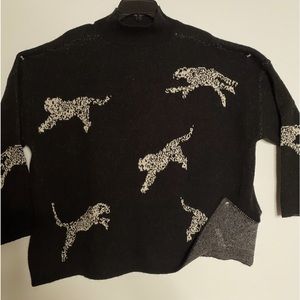 Size L sweater by SHEIN. Black with off white cheetahs.